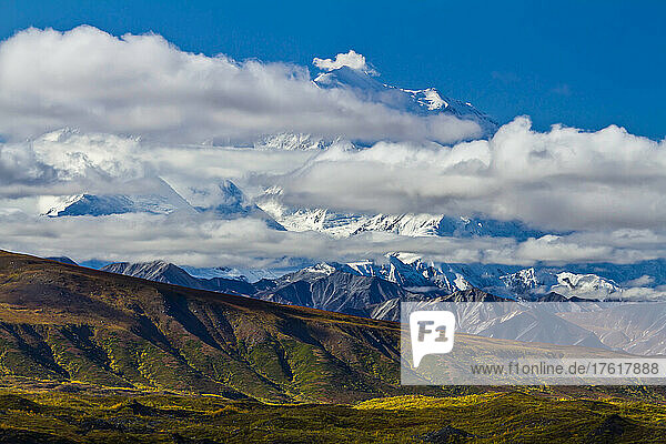 Clouds in front Mount McKinley over the tundra.