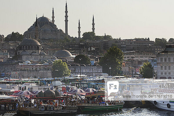 View of Sulumaniye Mosque  with Rustem Pasa Mosque in foreground  seen from Galata Bridge  Istanbul  Turkey; Istanbul  Turkey