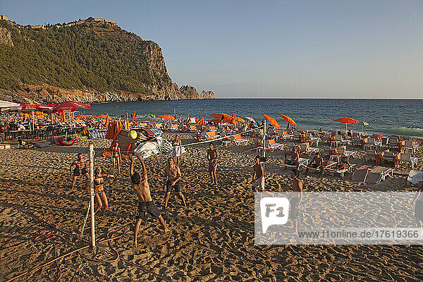 Beach volleyball and sunbathing on Cleopatra Beach; Alanya  Antalya Province  Turkey