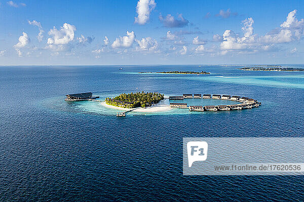 Bungalows surrounded by blue sea view at Kudadoo island  Maldives