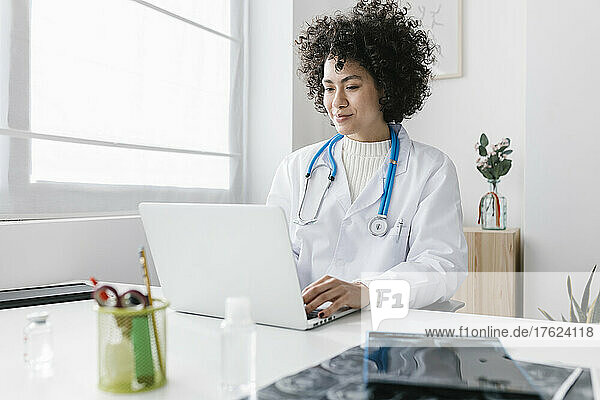 Doctor with laptop at medical clinic
