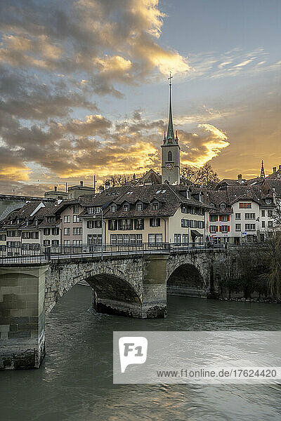 Switzerland  Canton of Bern  Bern  Untertor Bridge at dusk with bell tower of Nydegg Church in background