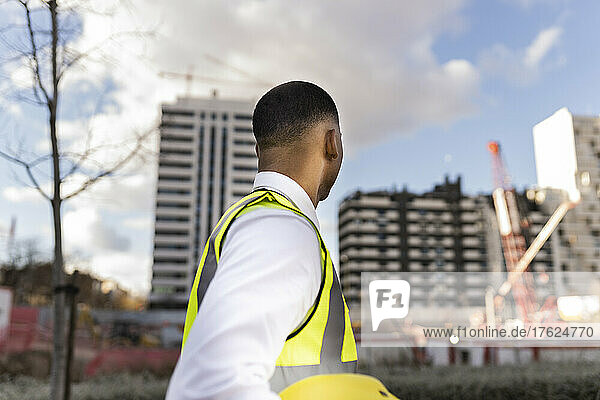 Engineer in reflective clothing at construction site
