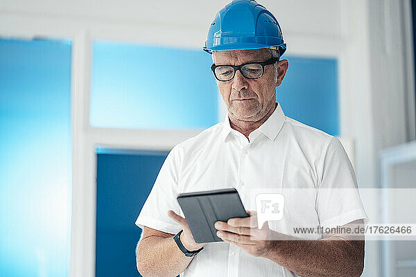 Construction worker using tablet computer