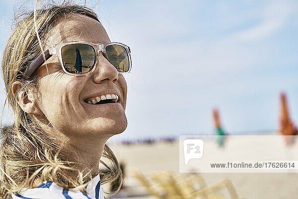 Happy woman spending leisure time at beach