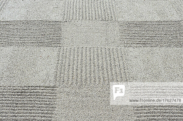 Grid pattern of raked gravel at a temple