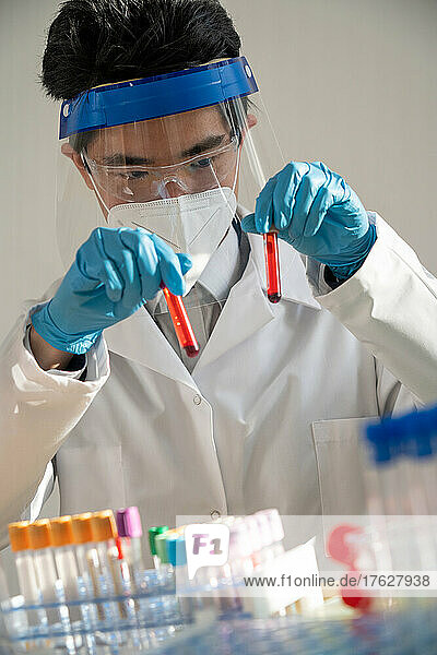 Laboratory technician performing blood tests in the laboratory.