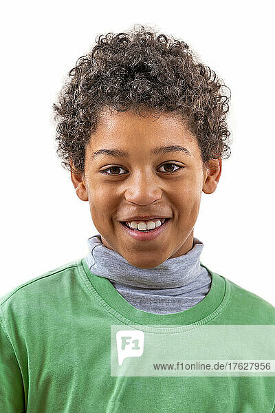 Little biracial smiling portrait on white close-up. Happy smile on white background