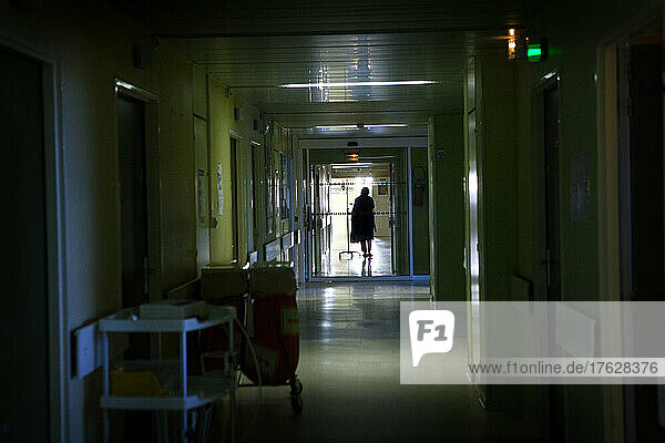 A patient in a hospital corridor.