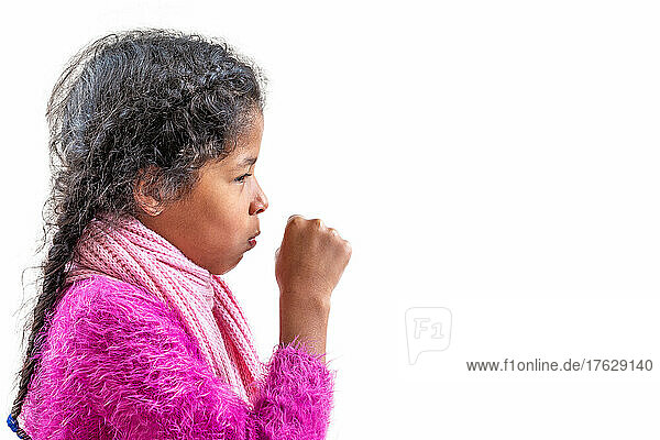 A young girl coughing  against white background with copy space.