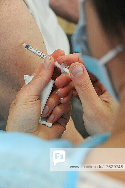 Nurse injecting covid-19 vaccine. Covid 19 vaccination center in Abbeville (80)  Pfizer vaccine. .