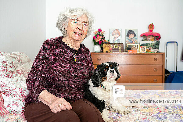 An octogenarian widow with her dog at the retirement home. Jacqueline refuses to leave Helsa  a King Charles who somewhat compensates for the loss of her husband last year.