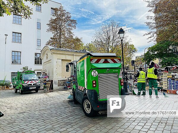 Cleaning machines for the streets and sidewalks of the city of Paris  here at the end of a market.