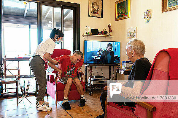 The daily life of a caregiver for a 60-year-old and his 55-year-old disabled son. This widower resumed smoking 2 years ago  after his wife who suffered from Alzheimer's died of cancer. Despite 2 heart attacks  he has trouble quitting smoking. Port-Vendres  OCCITANIA  FRANCE.