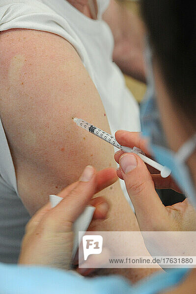 Nurse injecting covid-19 vaccine. Covid 19 vaccination center in Abbeville (80)  Pfizer vaccine. .
