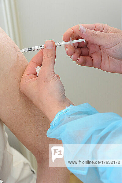 Nurse injecting covid-19 vaccine. Covid 19 vaccination center in Abbeville (80)  Pfizer vaccine.