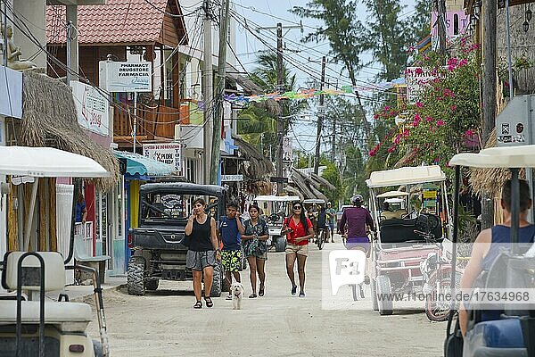 Strollers  Tourists  Golf Buggies  Main Street  Holbox  Isla Holbox  Quintana Roo  Mexico  Central America