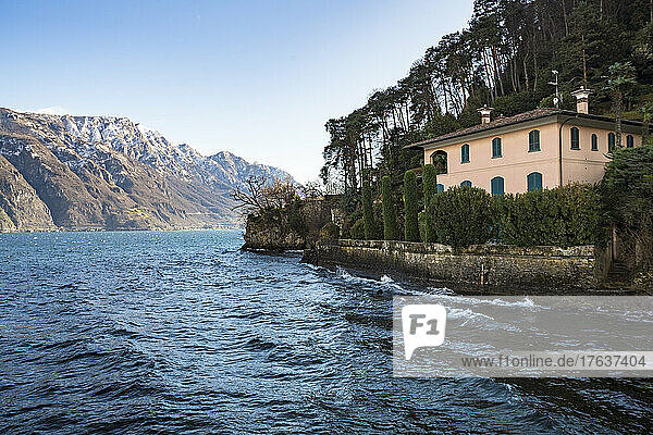 Italy  Como  Villa by lake Como with Alps in background