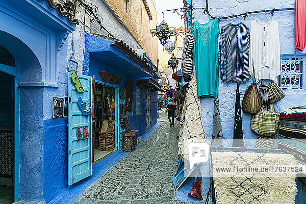 Morocco  Chefchaouen  Cobblestone alley and souvenirs for sale