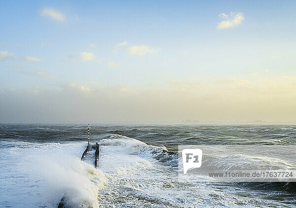 Netherlands  Vlissingen  Sea waves crashing against pier during storm Eunice
