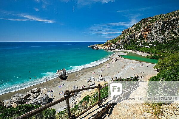 View of Preveli beach on Crete island with relaxing people and Mediterranean sea. Crete island  Greece  Europe
