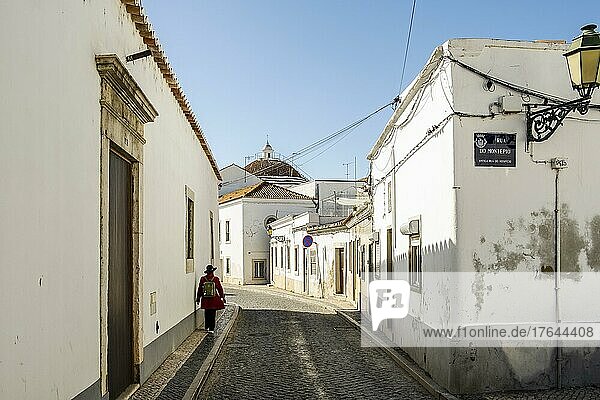 Narrow street with whitewashed buildings in downtown Faro  Algarve  Portugal  Europe
