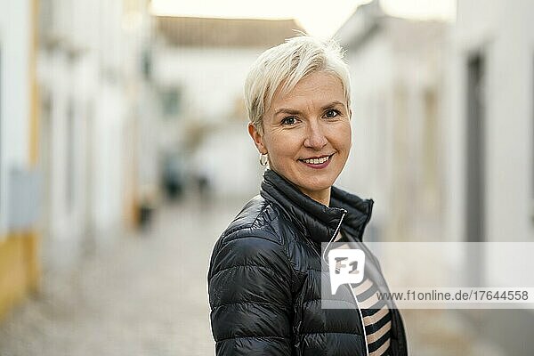 Portrait of blond woman in downtown of Faro  Algarve  Portugal  Europe