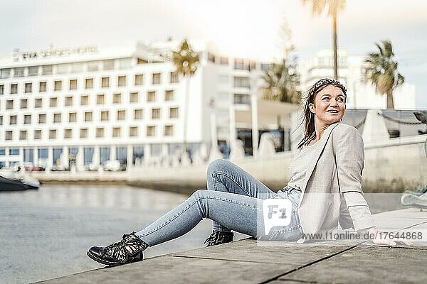 A portrait of a young woman enjoying time outdoor in marina