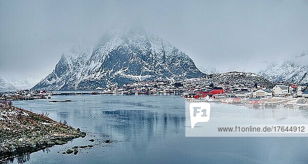Panorama of Reine fishing village on Lofoten islands with red rorbu houses in winter with snow. Lofoten islands  Norway