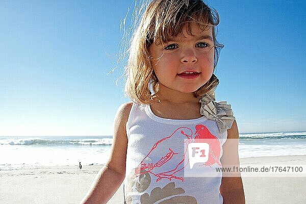 Happy baby girl at the beach in San Diego  California  USA  North America
