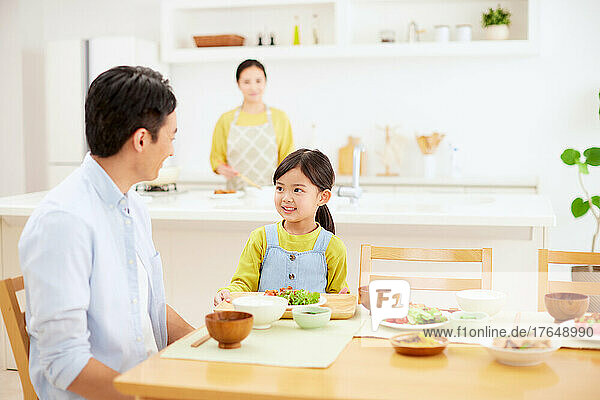 Japanese family eating together at home