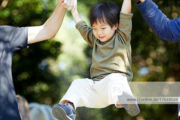 Japanese kid playing at the park