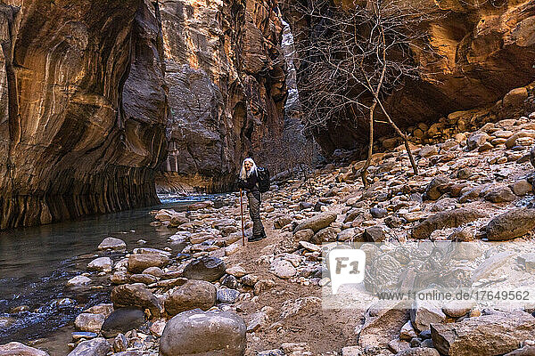 United States  Utah  Zion National Park  Senior female hiker at The Narrows of Virgin River in Zion National Park