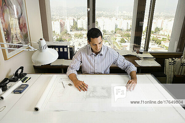 Architect at drafting table