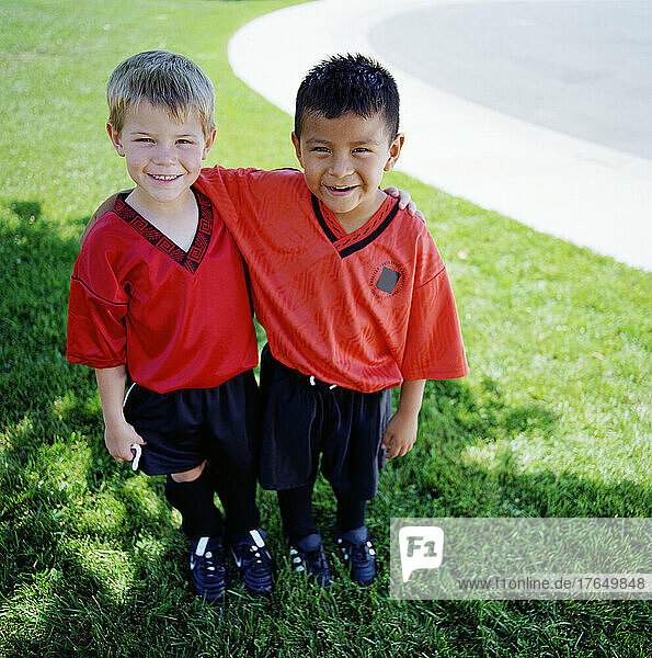 Portrait of two boys (4-5  6-7) wearing soccer uniforms