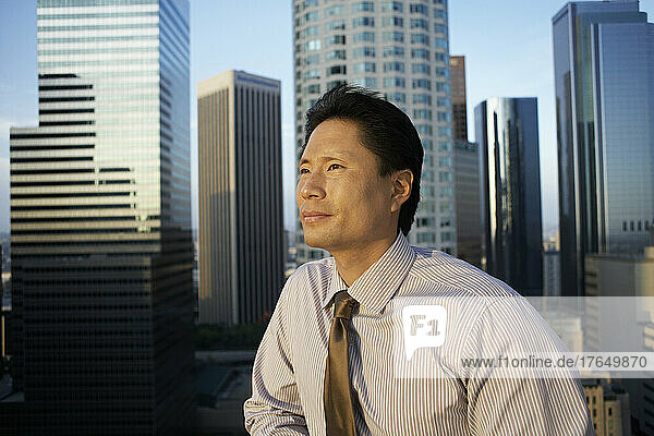 Businessman looking out at cityscape