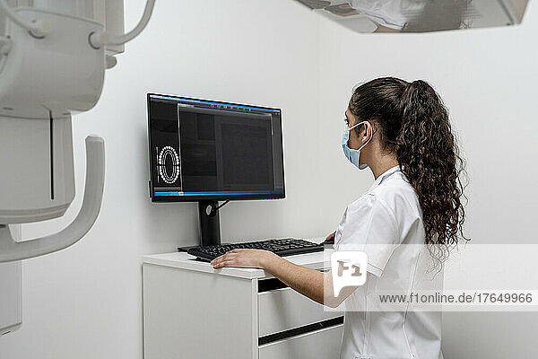 Nurse working on computer in maxillofacial clinic