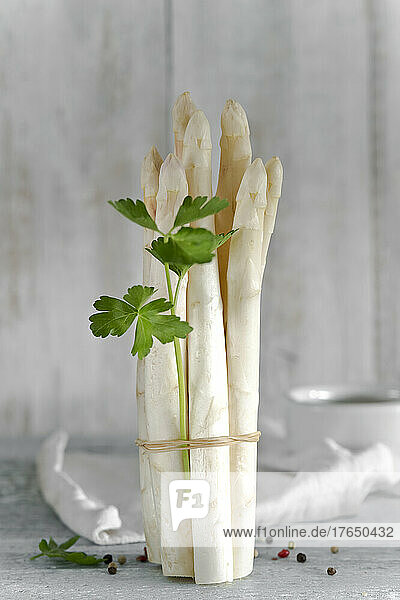 Bundle of white peeled asparagus stalks