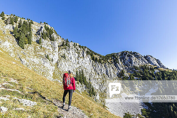 Female hiker admiring landscape of Bavarian Prealps