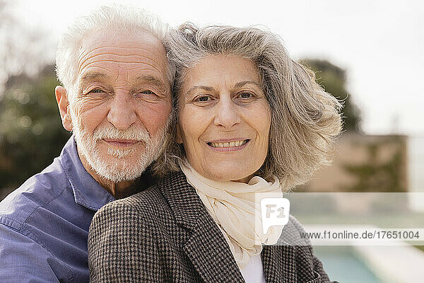 Smiling senior couple on sunny day