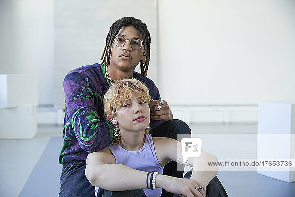 Young woman sitting with boyfriend