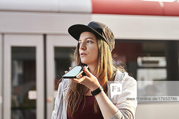 Young woman using smartphone in gthe city