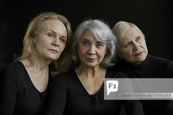 Senior women against black background