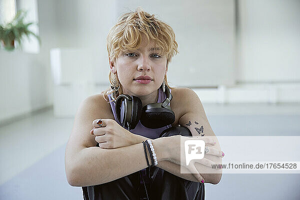 Young blond woman wearing headphones