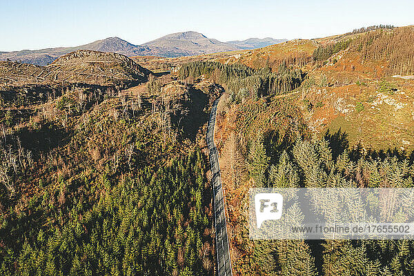 UK  Wales  Aerial view of highway stretching across autumn landscape of Snowdonia National Park