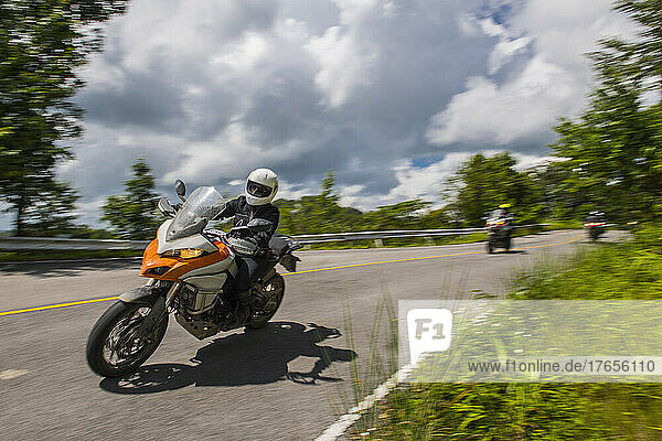 bikers speeding through the hills of northern Thailand
