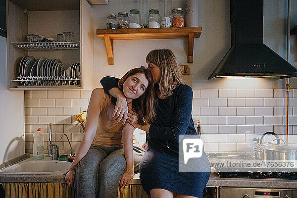 Two sisters in their home in kitchen