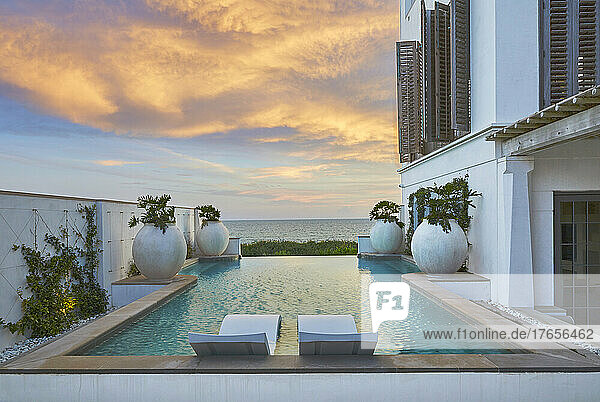 Pool with Waterfront view at Sunset