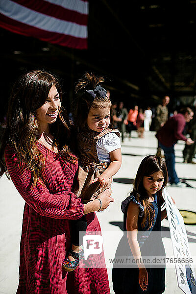 Mother & Two Daughters Waiting for Military Homecoming in San Diego