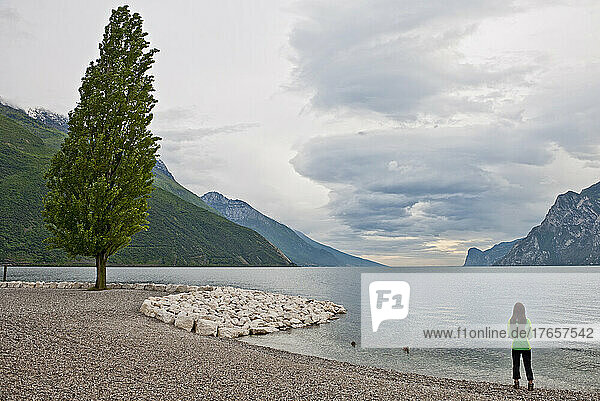 Woman looking out to Lake Garda in north Italy